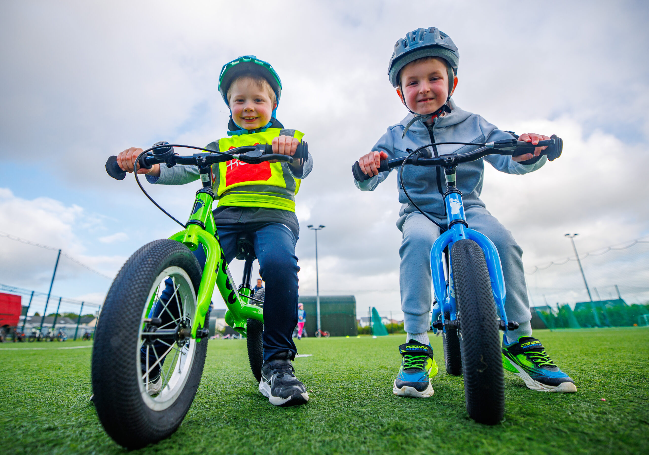 Image of two children learning how to cycle